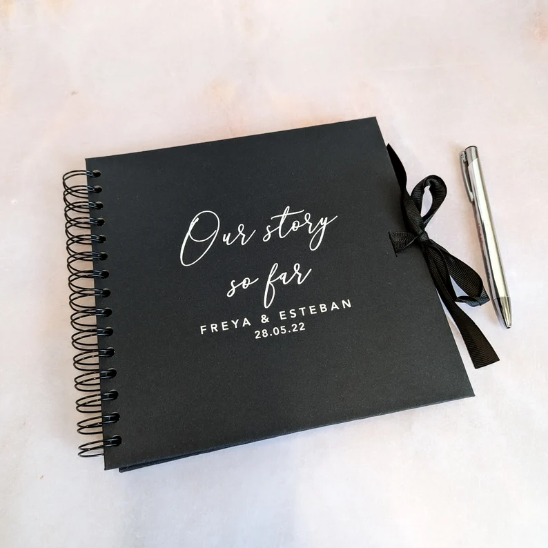 Memory book with pens for guests to write a message and for a keepsake.